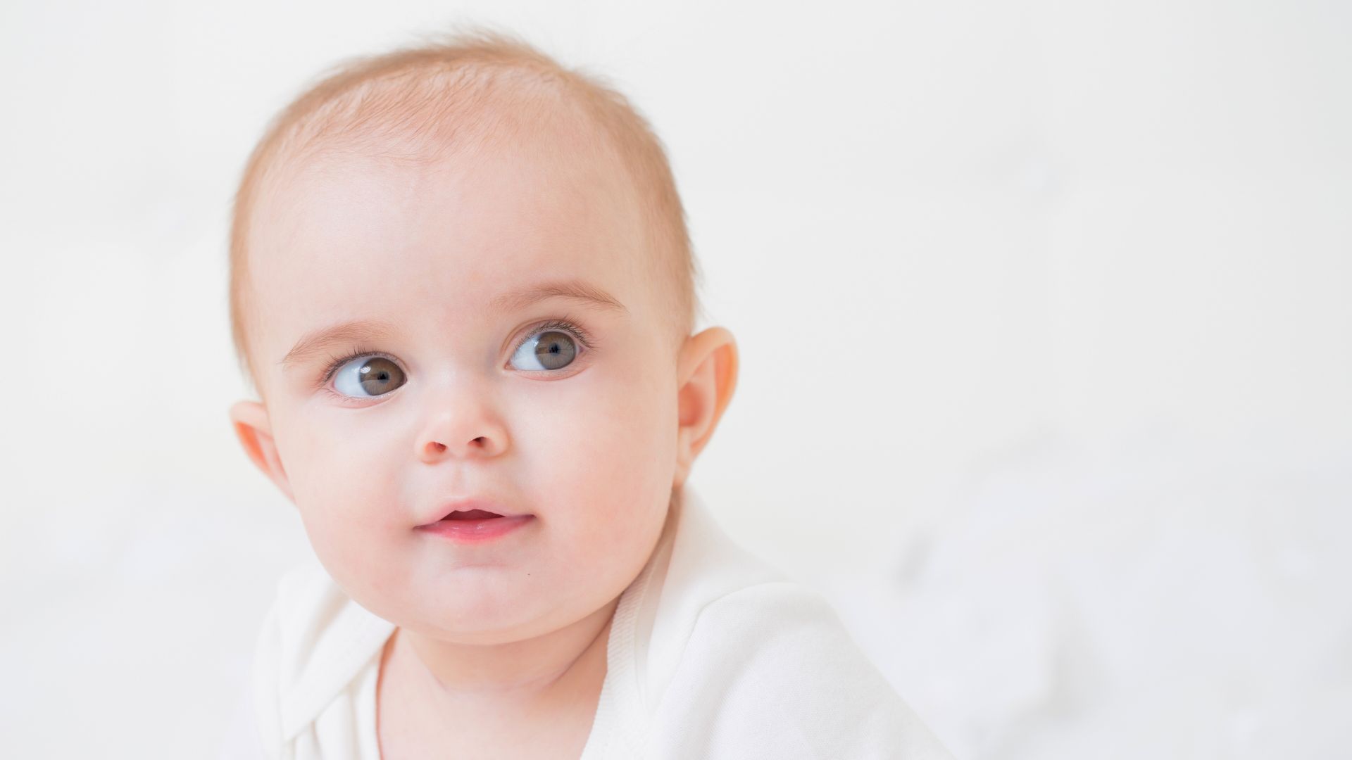 Baby looking upward with eyes partially rolled back
